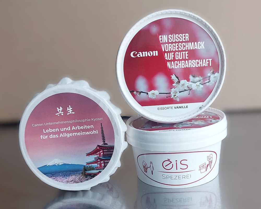 Signature Becher für die Firma Canon gebrandet. Mit Logo und Spruch auf dem Deckel